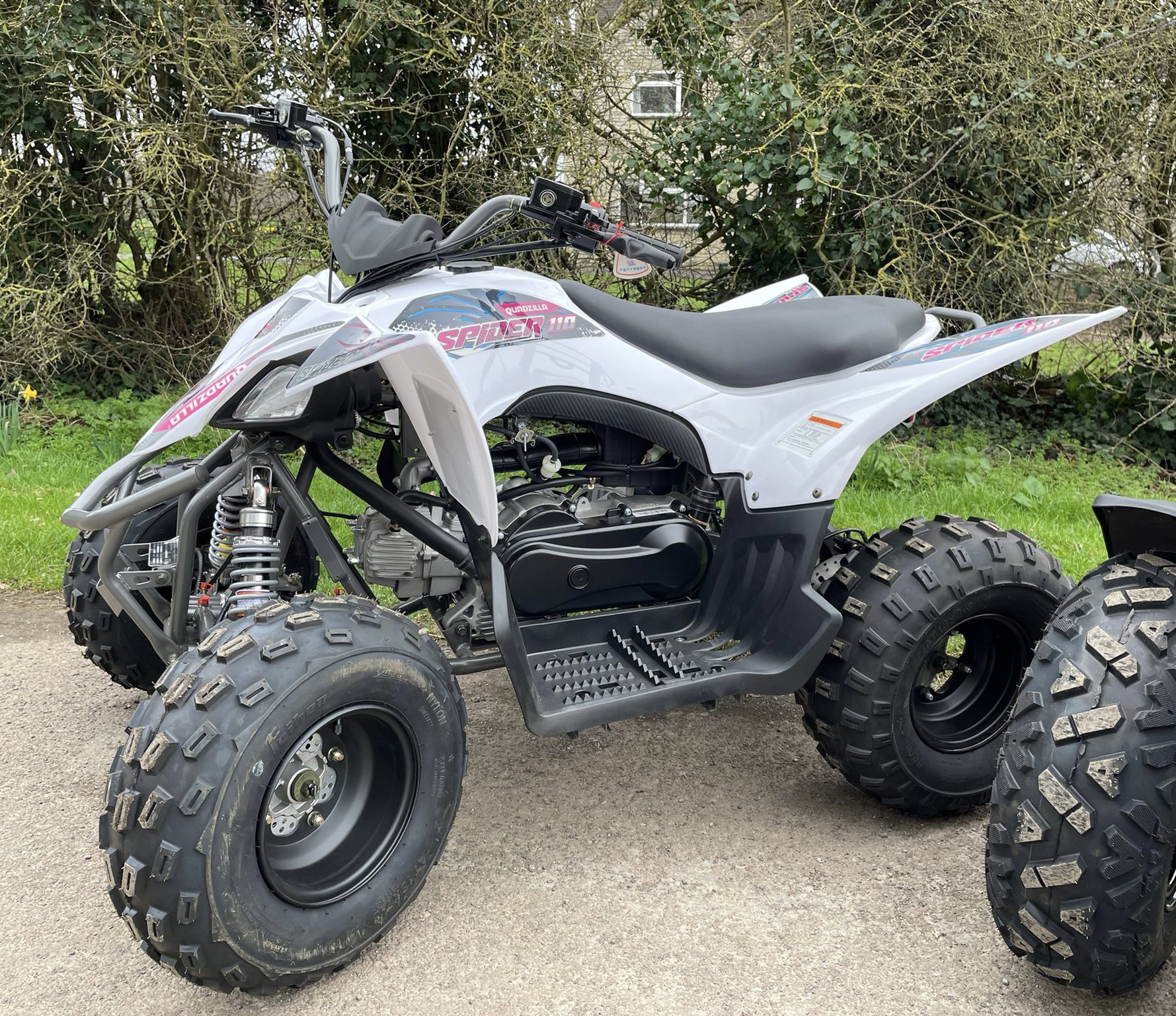 white quad with pink logos side view