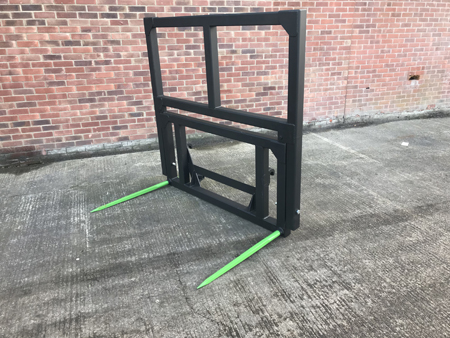 Double tine bale spike with extension